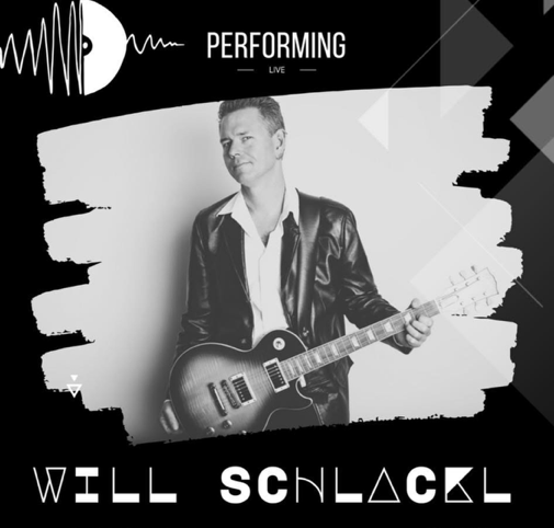 Will Schlackl performing live on stage.